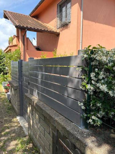 a black fence in front of a house at Casa del Lago in Monterosi