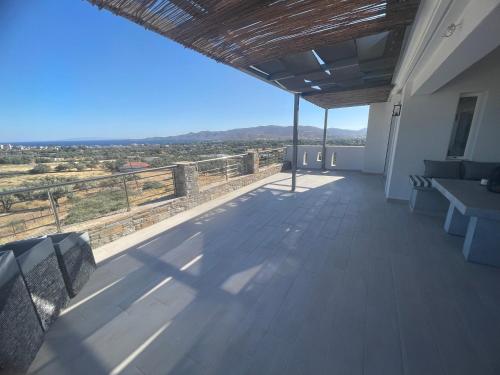 a view from the balcony of a house with a view at MIRAMAR KARYSTOS in Karistos