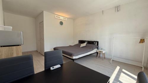a bedroom with a bed and a tv in it at Guest House - MXP, Lakes, Leonardo, 2 bedrooms in Sesto Calende