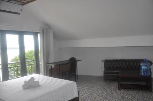 Katil atau katil-katil dalam bilik di Autumn Bay Riverside Villa