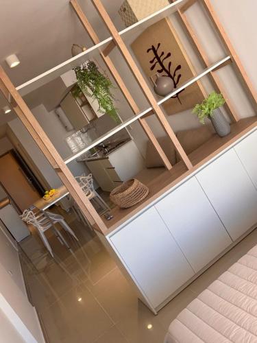 a kitchen with a counter with potted plants on it at Suit Chalet Santiago in Santiago del Estero