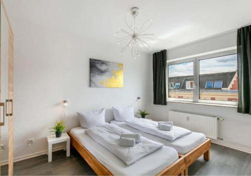 Ένα ή περισσότερα κρεβάτια σε δωμάτιο στο Berlin Central Premium Apartments for Groups