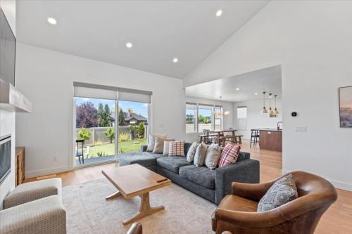 a living room with a couch and a table at Cherry Hill stay and play near lagoon in Kaysville