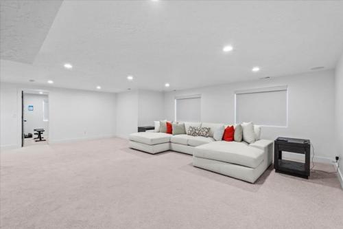 a living room with two white couches and a tv at Cherry Hill stay and play near lagoon in Kaysville