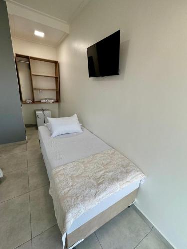 Una cama o camas en una habitación de Hotel Torre do Sal