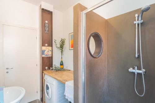 a bathroom with a shower and a sink at Casa Corbu by Rent All Como in Blevio