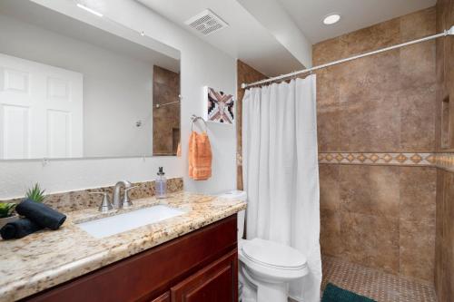 a bathroom with a sink and a toilet and a shower at Old Town Southwest Style 2BR Condo with Pool and Hot Tub in Scottsdale