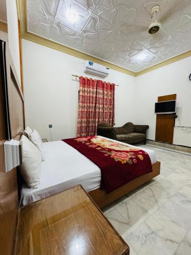 Кровать или кровати в номере Comfort Rezidor Guest House