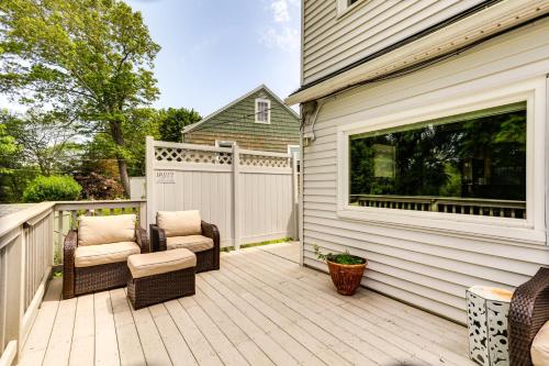 a patio with two chairs and a window on a house at Lakefront Cottage 2 Mi to Palladium in Worcester! in Worcester