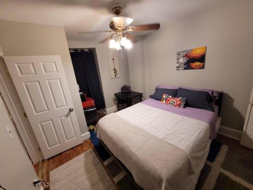 a bedroom with a bed and a ceiling fan at Bloomingdale Stays, Washington DC in Washington