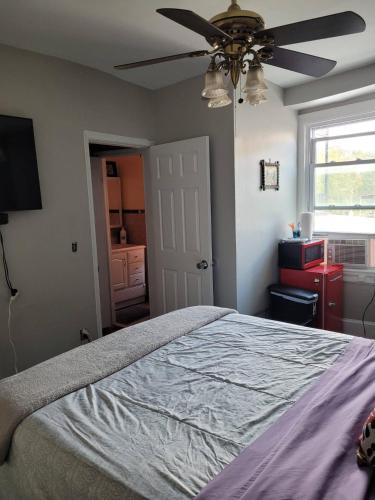 a bedroom with a bed and a ceiling fan at Bloomingdale Stays, Washington DC in Washington