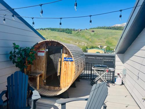 a wooden sauna on the deck of a house at Mountain Views Retreat - Close to All - Private Sauna in Silverthorne