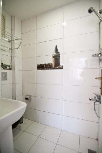 a white bathroom with a sink and a building at SeaShore Hotel in Istanbul