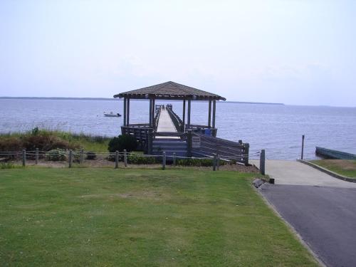 a gazebo on the side of the ocean at Villas M1 in Nags Head