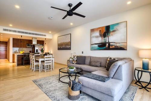 a living room with a couch and a ceiling fan at Family Friendly APT 17 ocean view, 3BR, 6 pax in San José del Cabo