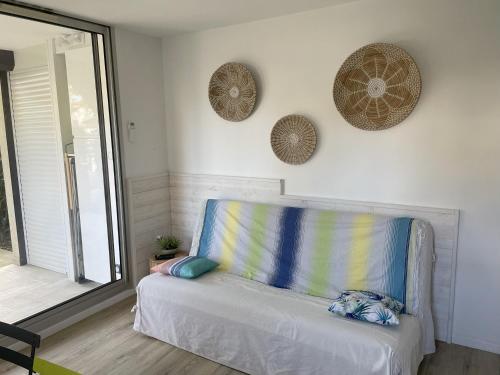 a blue couch in a room with a window at Studio Argelès sur Mer in Argelès-sur-Mer