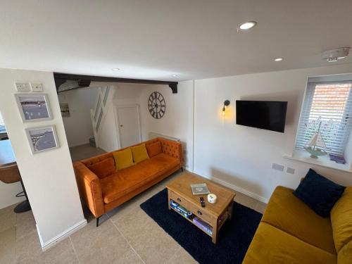 a living room with a couch and a table at The Granary in Bridlington