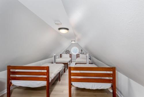 a row of beds in a room with white ceilings at Out of Office in Ottawa