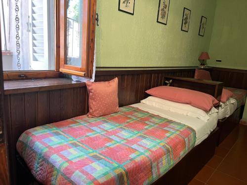 Katil atau katil-katil dalam bilik di Residence Casa Lama