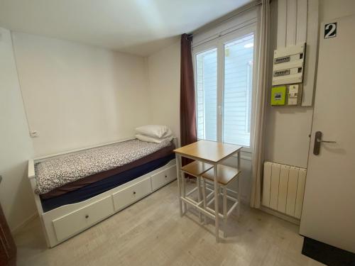 Ένα ή περισσότερα κρεβάτια σε δωμάτιο στο Tiny Nest 42