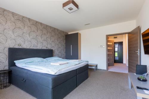 Postel nebo postele na pokoji v ubytování Prince apartment downtown