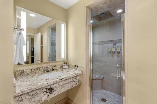 a bathroom with a sink and a shower at Best Western Plus Arroyo Roble Hotel & Creekside Villas in Sedona