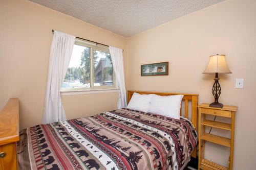 a bedroom with a bed and a window at Hi Country Haus Unit 0406 in Winter Park