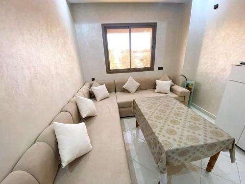 a living room with a couch and a table at Prime Location, Budget Friendly Studio in Central 