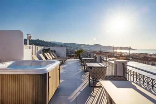 a hot tub on the roof of a building at Best Western Hotel Nazionale in Sanremo