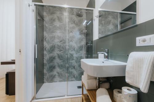 a bathroom with a sink and a shower at Dimora Favia in Bari