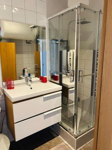 a bathroom with a shower and a sink at Casa Red Riviera in Juan-les-Pins