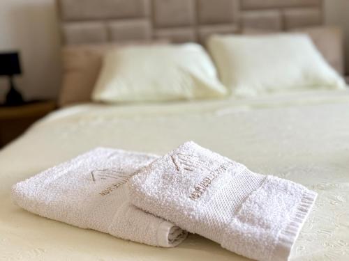 Ένα ή περισσότερα κρεβάτια σε δωμάτιο στο Maribelle Apartments
