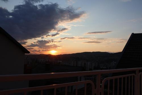 a sunset from the balcony of a building at Bella in Sarajevo