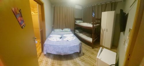 Postel nebo postele na pokoji v ubytování Pousada Praia do Trapiche