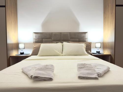 Postel nebo postele na pokoji v ubytování Maribelle Apartments