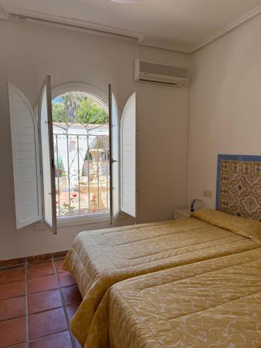 Ένα ή περισσότερα κρεβάτια σε δωμάτιο στο Villas PdZulueta