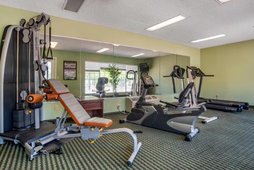 a gym with treadmills and ellipticals in a room at Econo Lodge Tupelo Barnes Crossing in Tupelo