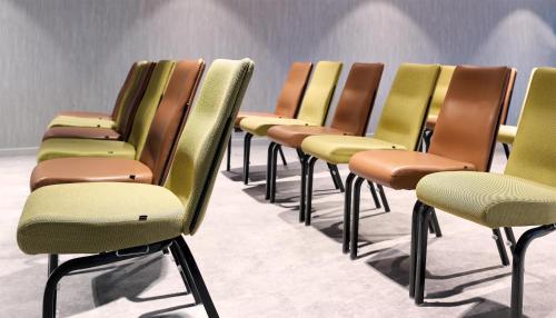 a row of chairs in a waiting room at Park Inn By Radisson Brussels Airport in Diegem