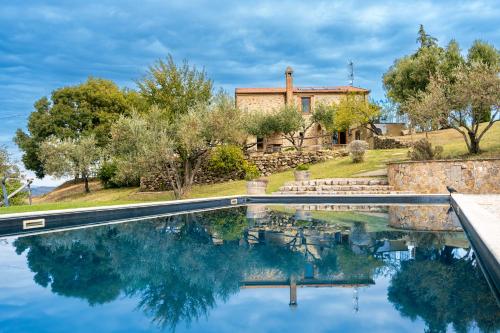 an exterior view of a house with a swimming pool at BnB Meridiana in Cana