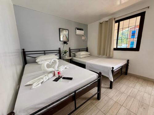 Postel nebo postele na pokoji v ubytování Marion Roos Hotel