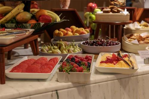 a buffet filled with different types of fruits and vegetables at Radisson Hotel & Residence Riyadh Olaya in Riyadh