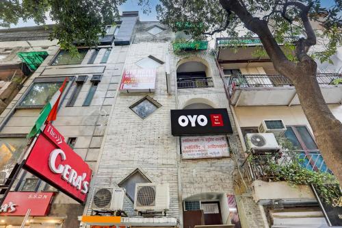 a building with an ovy sign on the side of it at Hotel O Metro Residency in New Delhi