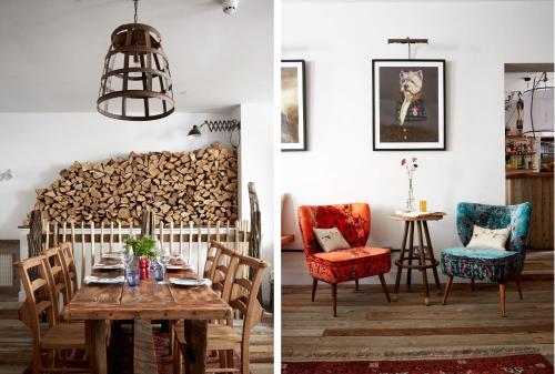 a room with a table and a pile of fire wood at Artist Residence Cornwall in Penzance