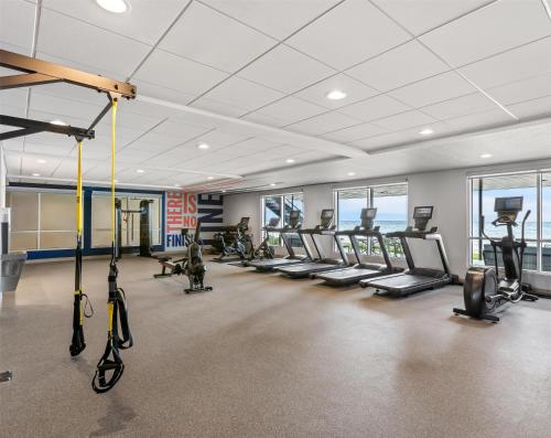 a gym with treadmills and elliptical machines at Hampton Inn St Ignace Lakefront Mackinac in Evergreen Shores
