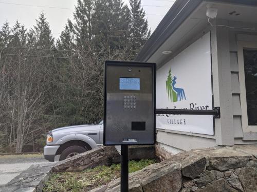 a parking meter in front of a building at Mountain House of Wonder in Qualicum Beach
