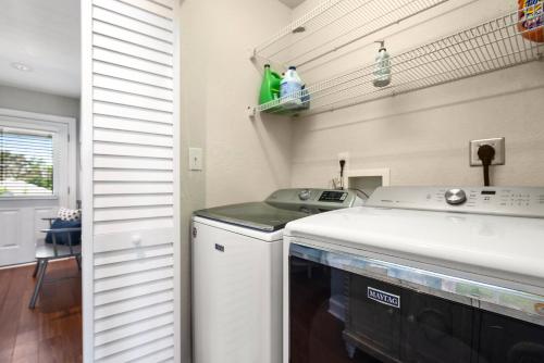 a kitchen with a sink and a dishwasher at Worthington Lane in Kitty Hawk