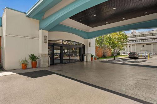an empty lobby of a building with a blue roof at Airport Honolulu Hotel, Trademark Collection by Wyndham in Honolulu