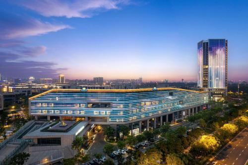 an overhead view of a building in a city at night at Days Hotel by Wyndham Yancheng Hi-tech Park in Yancheng