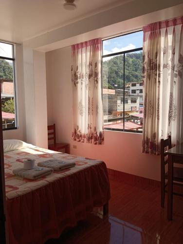 Postel nebo postele na pokoji v ubytování Casa Hospedaje Inkani