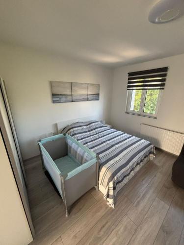Ένα ή περισσότερα κρεβάτια σε δωμάτιο στο Studio Apartman NoNa